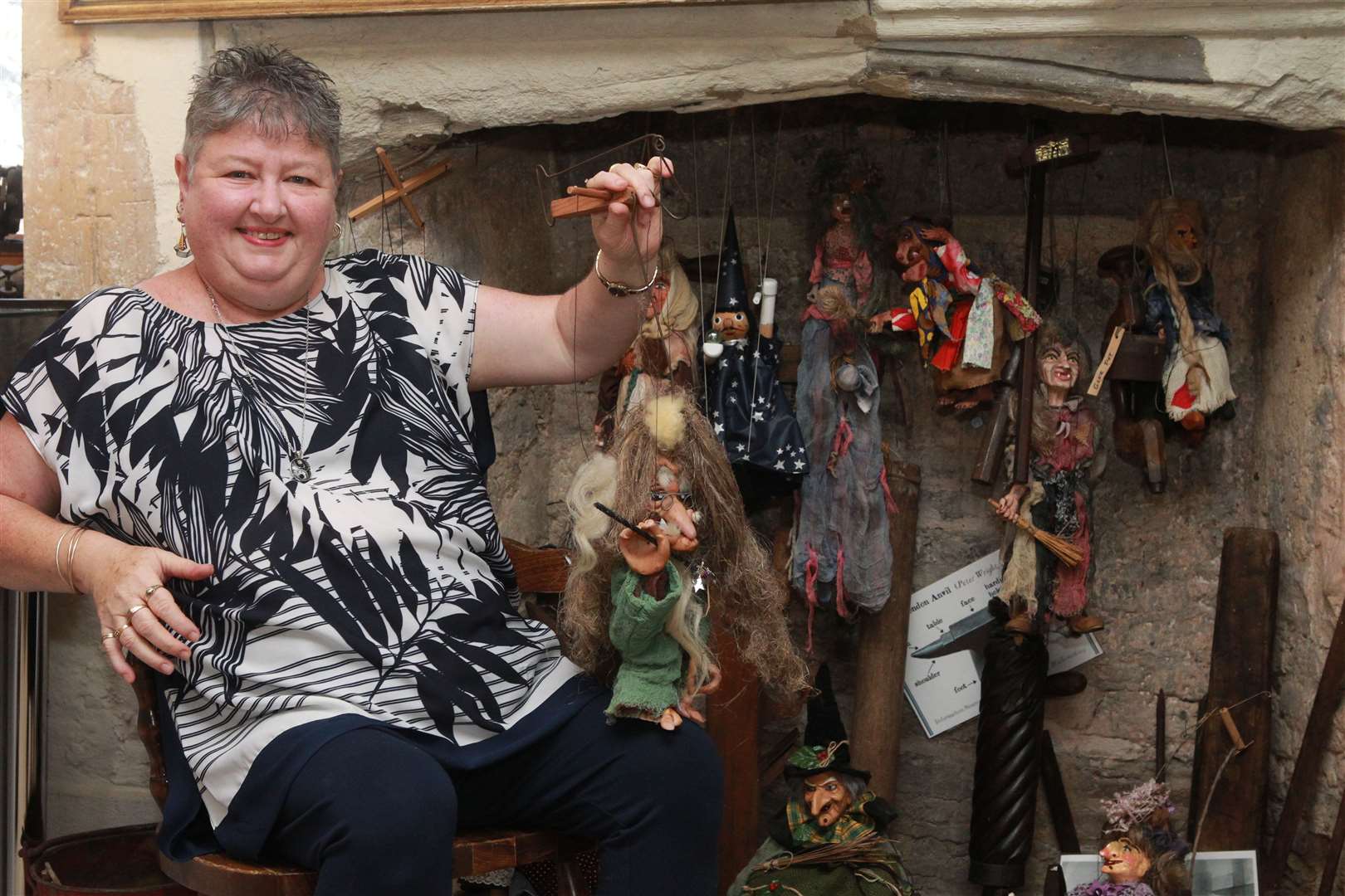Karen Crowder with her collection of witches. Picture by: John Westhrop