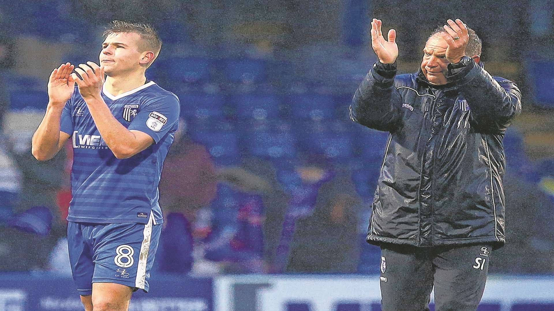 Gillingham's Jake Hessenthaler and Steve Lovell thank the fans at the final whistle. Picture: Andy Jones