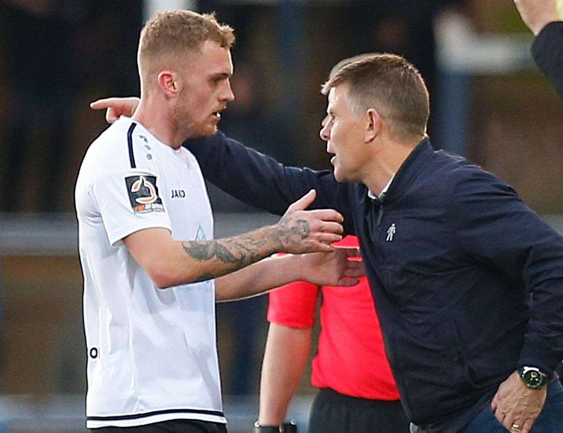 Dover boss Andy Hessenthaler gives Bobby-Joe Taylor some instructions at Peterborough on Sunday Picture: Andy Jones.