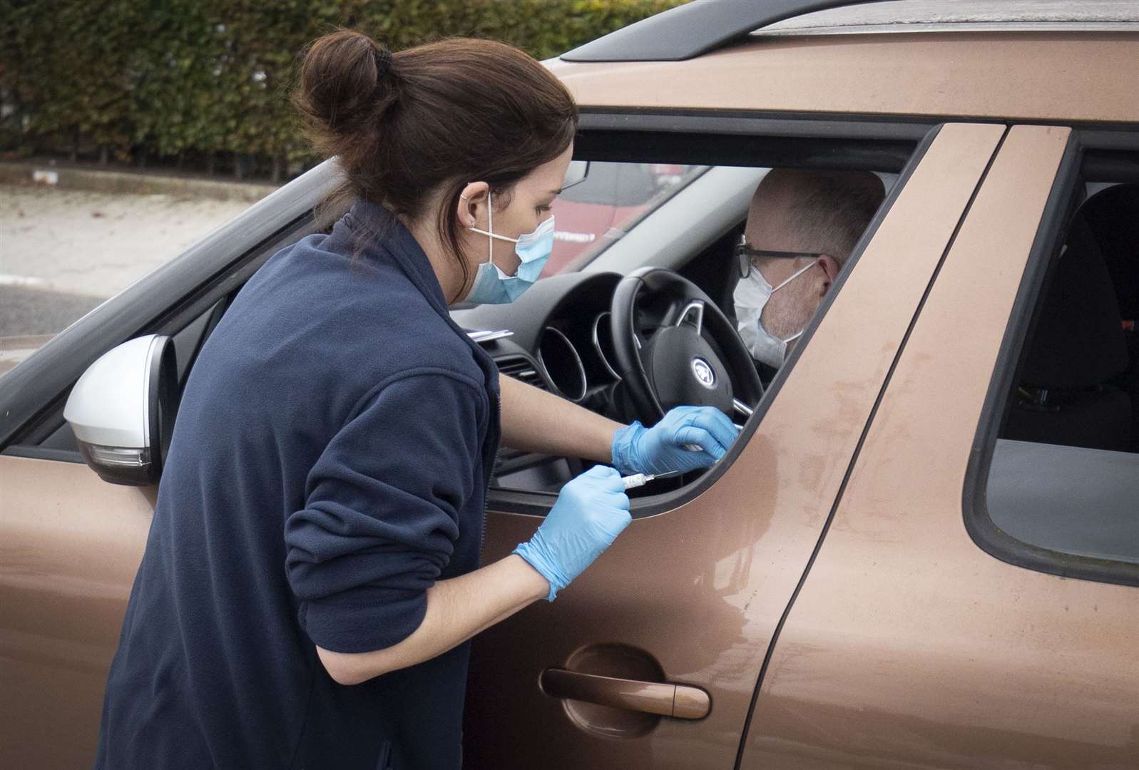 Flu vaccines were also given at drive-thru centres last year (Jane Barlow/PA)