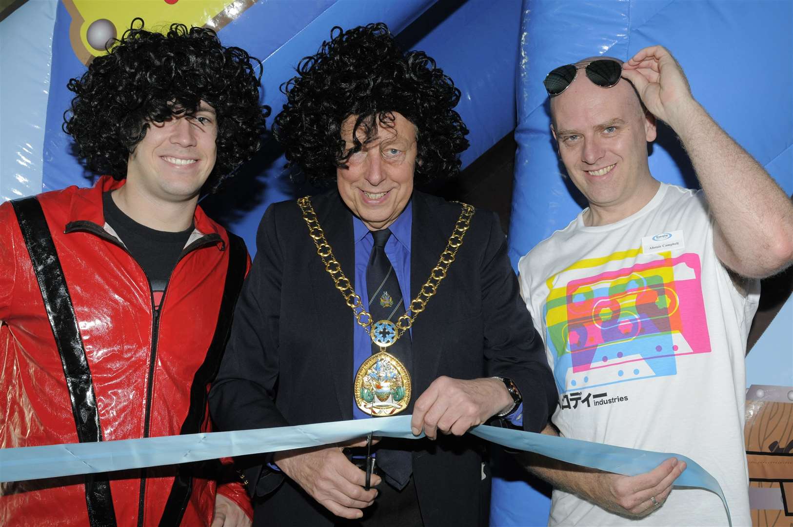 James Reynolds, then Mayor of Swale Adrian Crowther and Alistair Campbell cutting the ribbon to open a new slide and 1980s themed event to mark the 20th anniversary of the Swallows Leisure Centre, Sittingbourne. Picture: Andy Payton