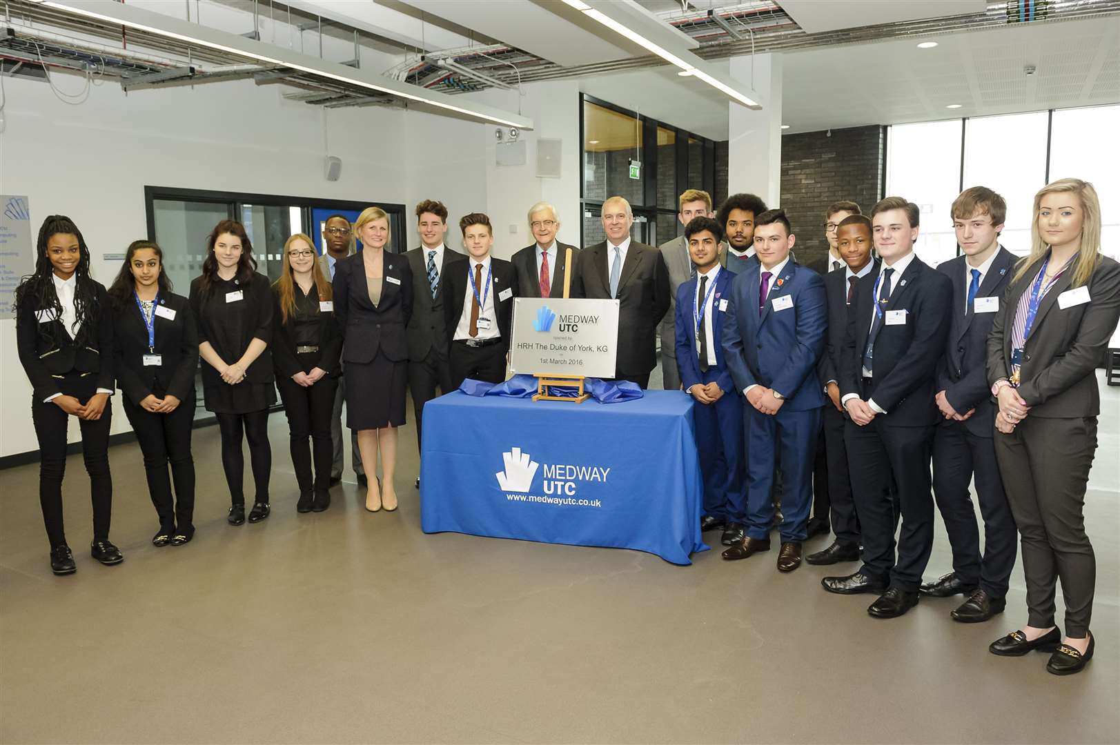 Staff and students with HRH the Duke of York and the commemorative plaque for the opening