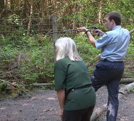 Vet Ian Cope takes aim with the dart gun at the Herne Common conservation park. Picture: Peter Smith