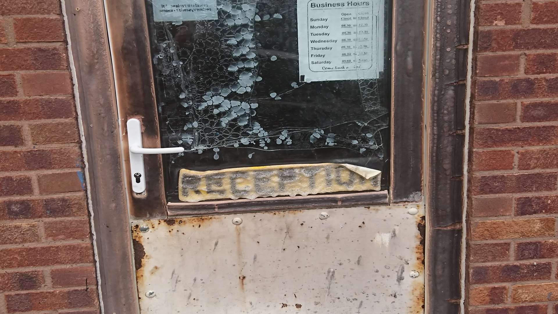 The reception sign on the door melted