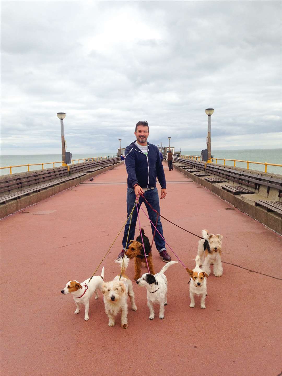 Steven Colburn enjoys a stroll on the Pier with his four-legged friends following the introduction on the PSPO on Monday