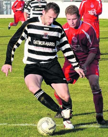 Deal Town's Scott Holden takes on the Hythe defence