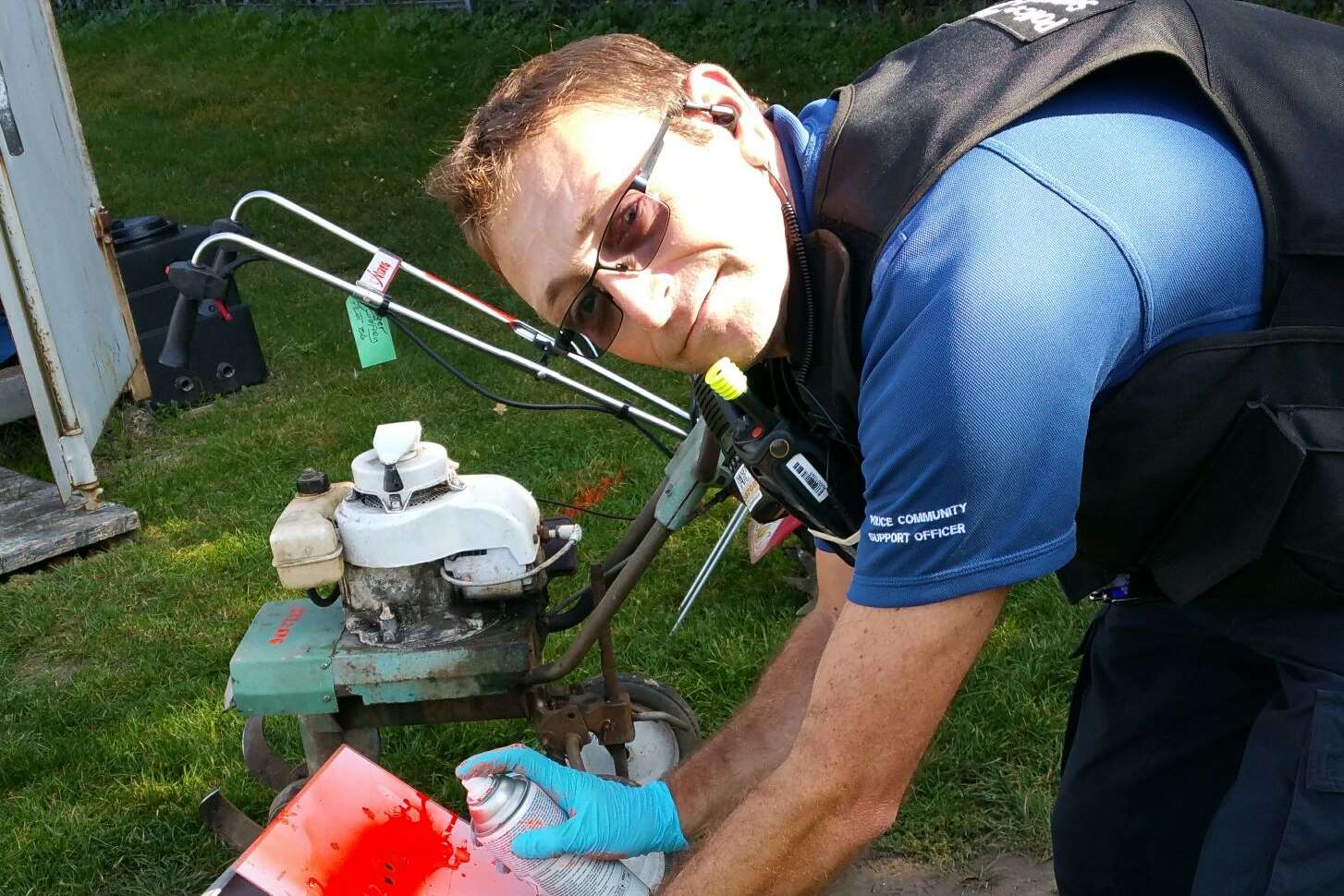PCSO John Litchfield marking a wheelbarrow. Pic: Kent Police