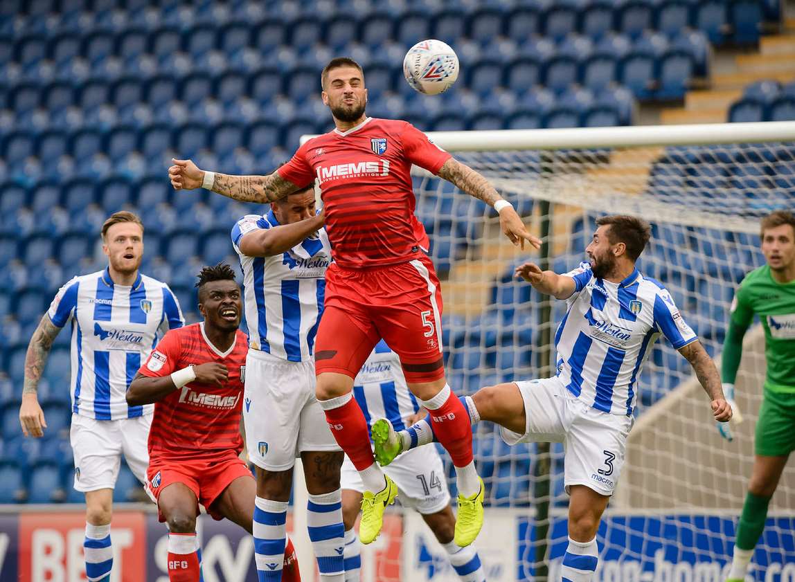 Gillingham defender Max Ehmer goes up for the ball Picture: Andy Payton