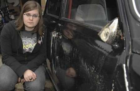 Joanne George beside her damaged vehicle. Picture: ANDY PAYTON