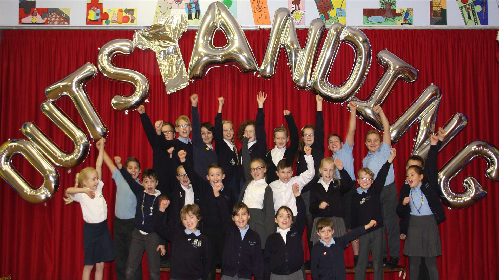 Staff and pupils at Upton Junior School in Broadstairs celebrate their Ofsted result