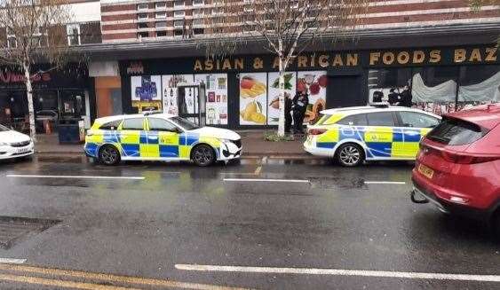 Three police cars were called to the scene outside Asian and African Bazaar in the town centre. Picture: William White