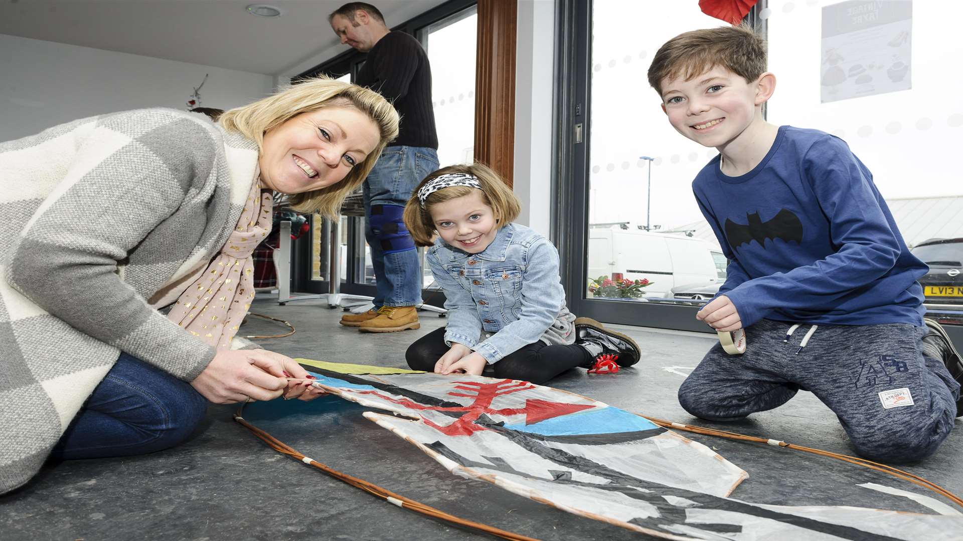 Gemma Myers, Lola Myers, seven, and Dougie Myers, 10, enjoy the workshop. Picture: Andy Payton