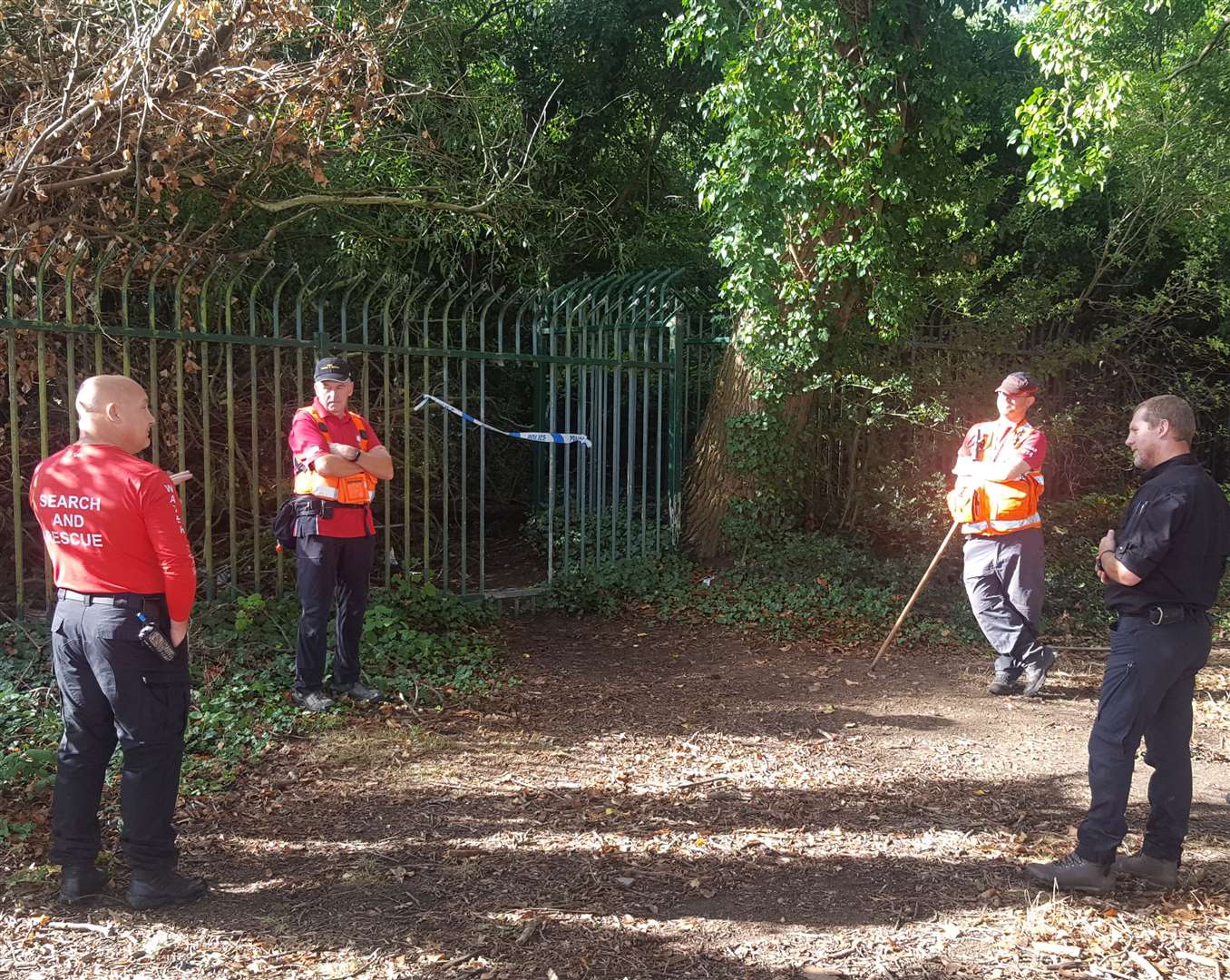 Search and rescue teams at an unofficial entrance to the woodland on the day of Robbie's death