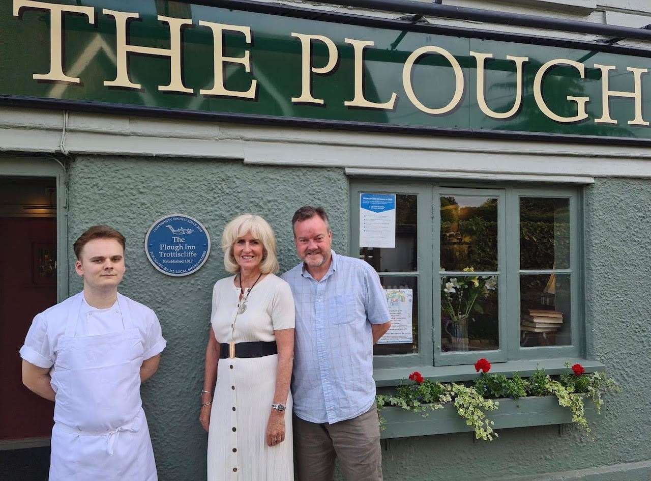 Alex Yates, left, with Alison Prountzos and Les Hutchison, both of the Trottiscliffe Community Benefit Society, outside Bowleys at The Plough in West Malling
