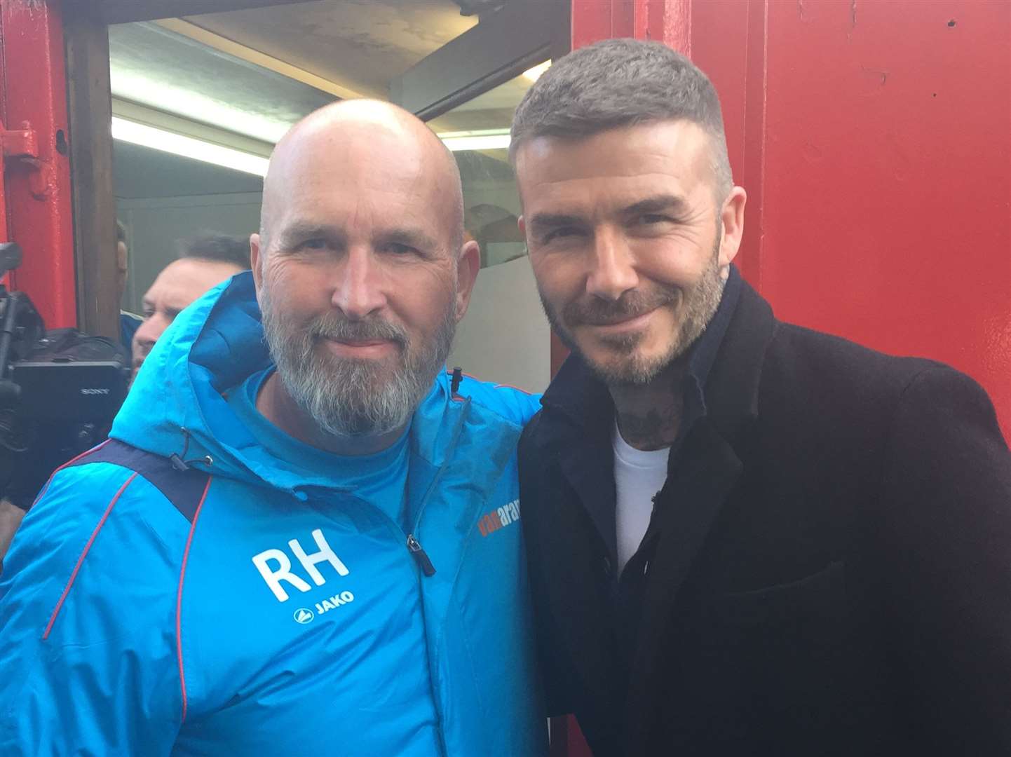 Richard Harvey, pictured with Man Utd and England legend David Beckham, set up Scott Holding’s move to Dover.