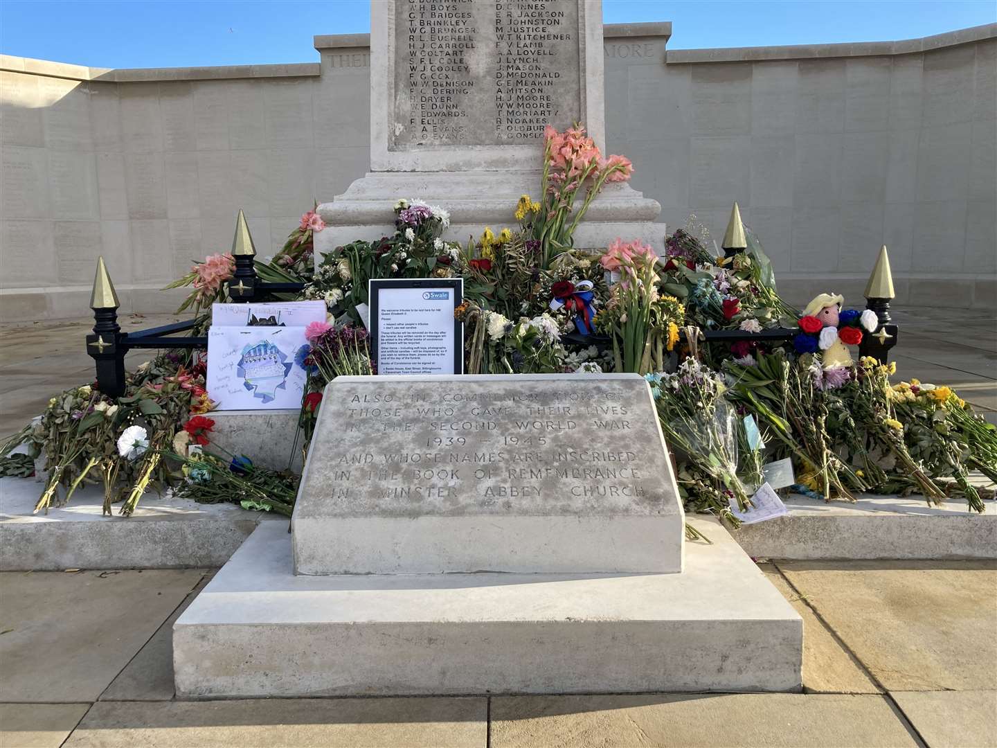 Floral tributes left at the base of the war memorial in Sheerness to mark the death of The Queen. Picture: John Nurden