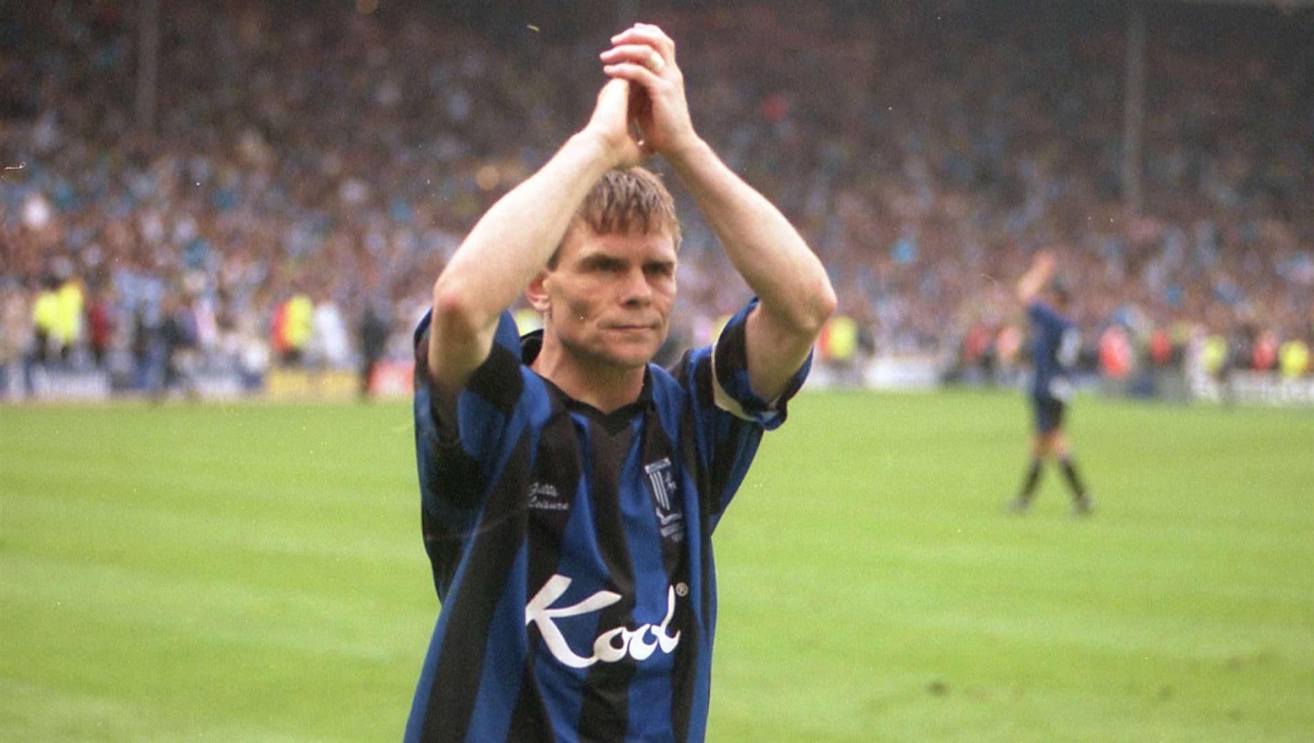 Pictured during the Gillingham FC v Manchester City play-off in May 1999, Andy Hessenthaler applauds Gills fans