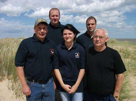 Paige and Michael Anderson with the lifeboat crew who helped saved her