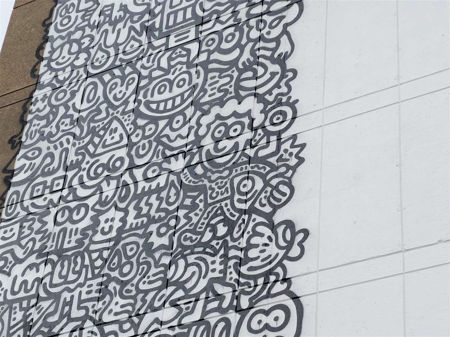 Mr Doodle features within the mural as well as his evil twin and 'doodle dog'