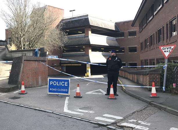 Police at the car park where the man's body was found.