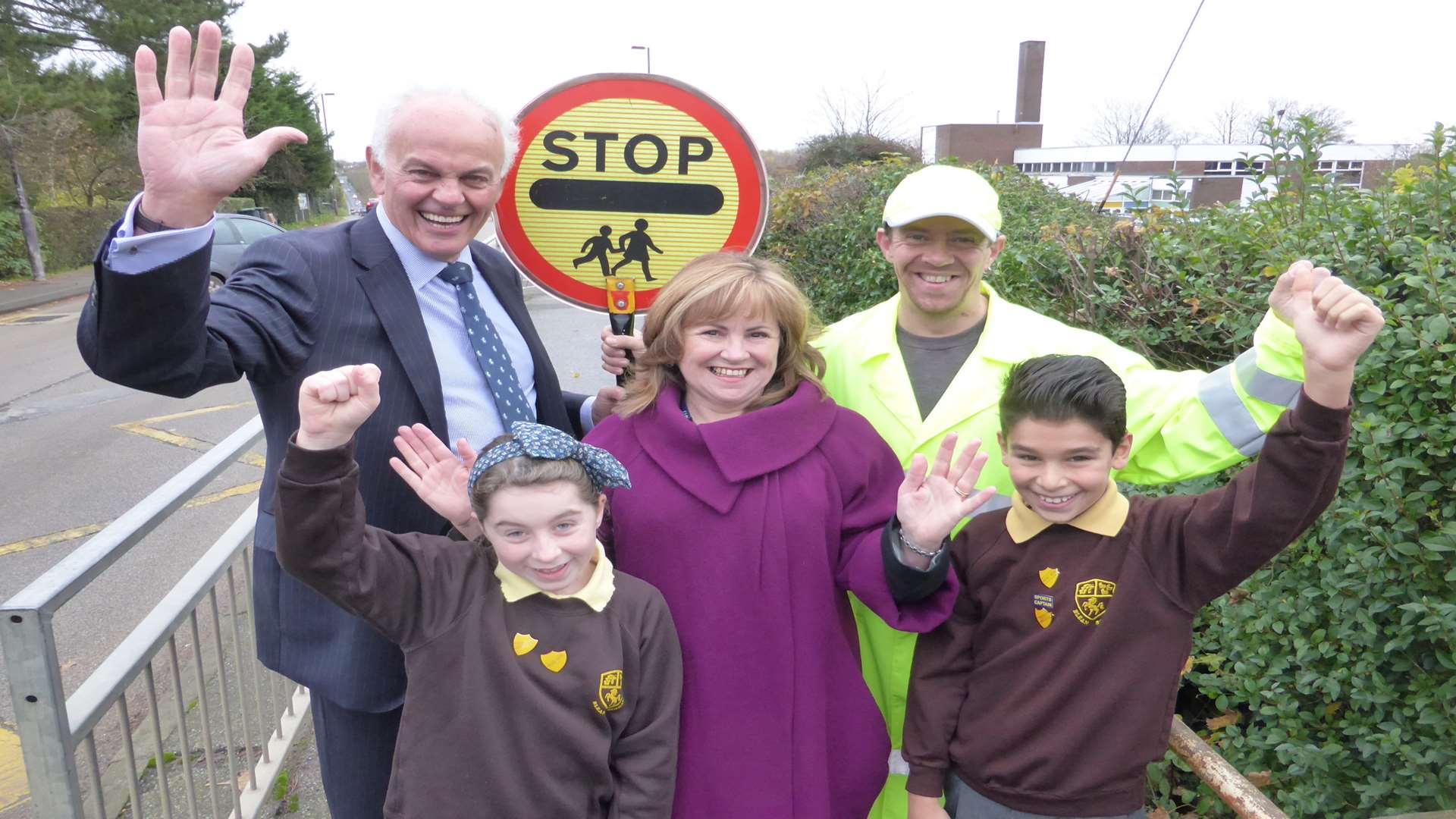 Cllr Clive Pearman of KCC, lollipop man Nick Foreman and Blean Primary head teacher Lynn Lawrence with pupils Theo Panteli and Keira Padamsee, both 10, announce new category of Best Road Crossing Patrol for annual KM Walk to School Awards which are open for nominations.