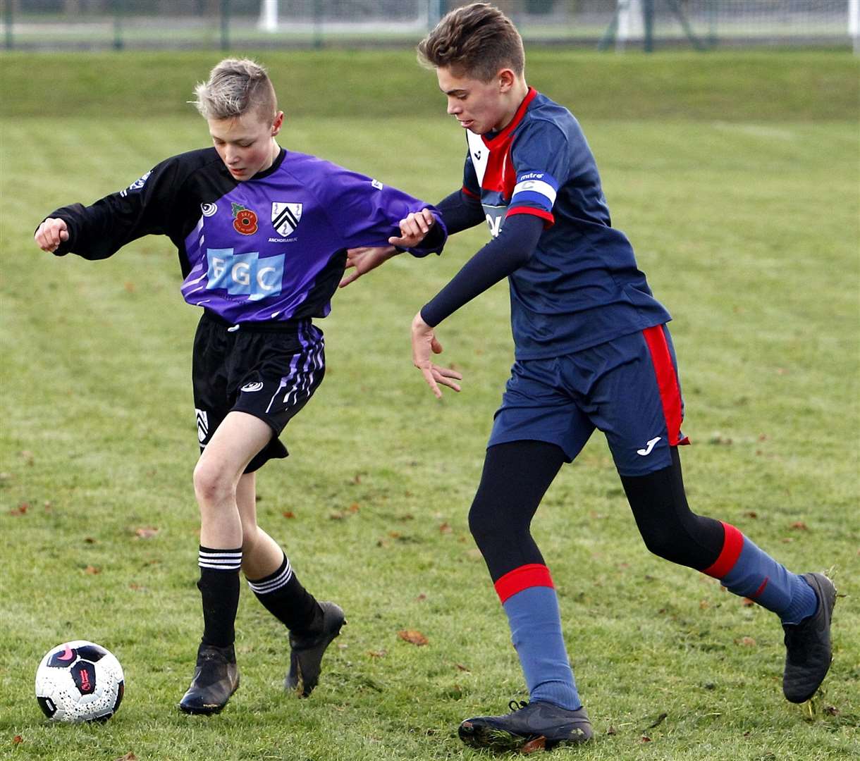 Anchorians United under-14s (purple) on the ball against Hempstead Valley Rangers under-14s. Picture: Sean Aidan FM21304831
