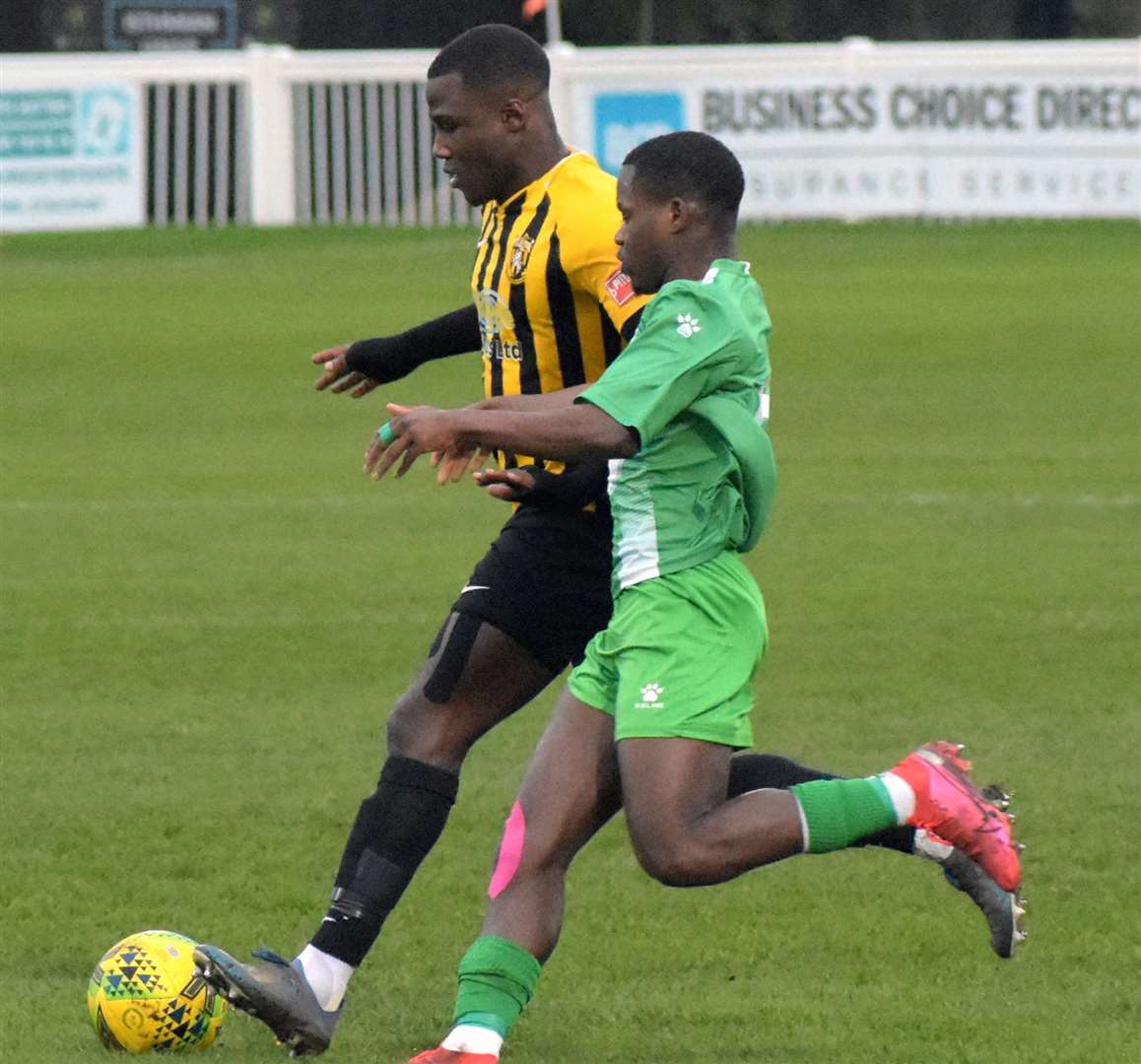 Ade Yusuff is challenged by a Leatherhead player. Picture: Randolph File