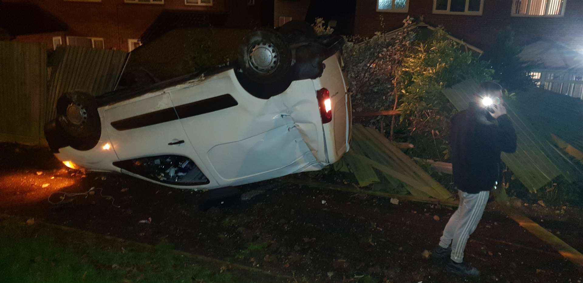 The van flipped on its roof and flattened two garden fences in the back garden in Hempstead Valley Drive, Hempstead